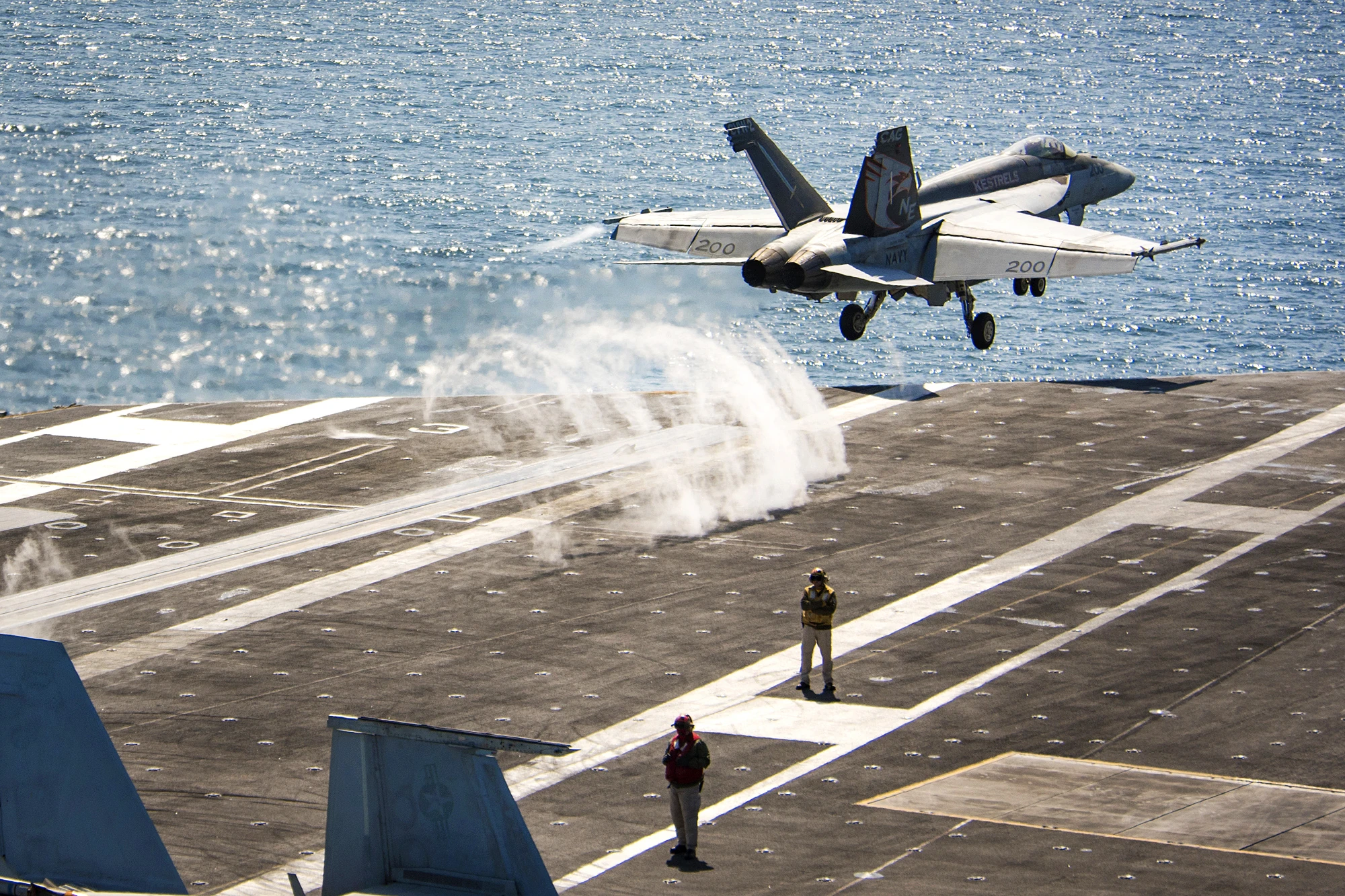 U.S. Navy photo by Petty Officer 3rd Class Matthew Granito. A U.S. Navy F/A-18E Super Hornet launching from USS Carl Vinson above catapult steam.